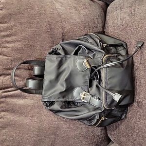 Shiny black backpack purse